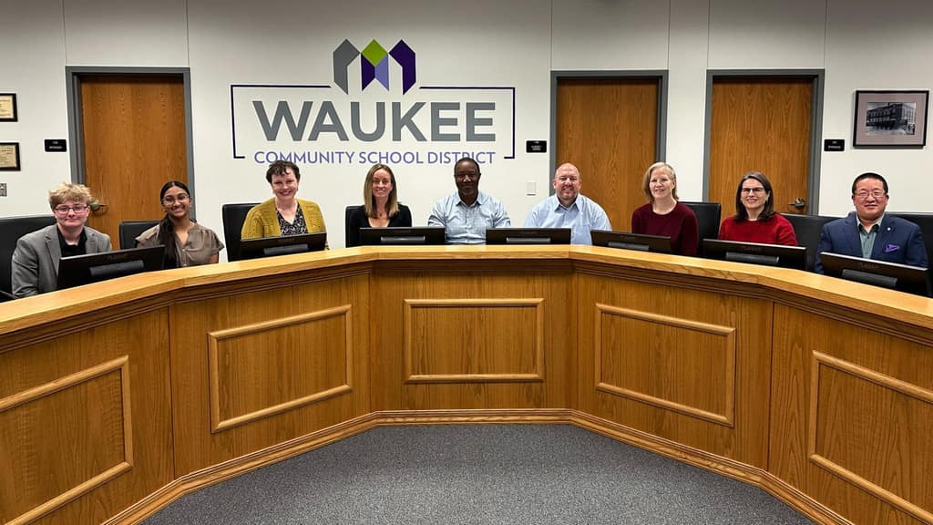 The Waukee CSD School Board seated at the board table