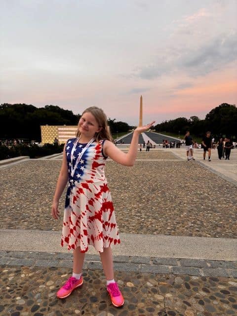 The student poetry-contest winner at the Lincoln Memorial in Washington, D.C.