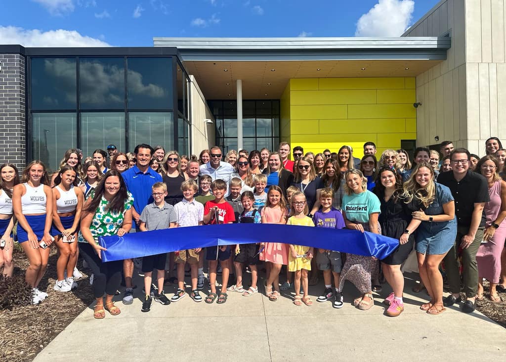 Students and staff at a school ribbon cutting
