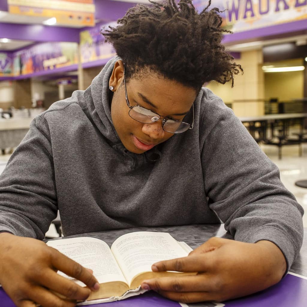 A student reading a book